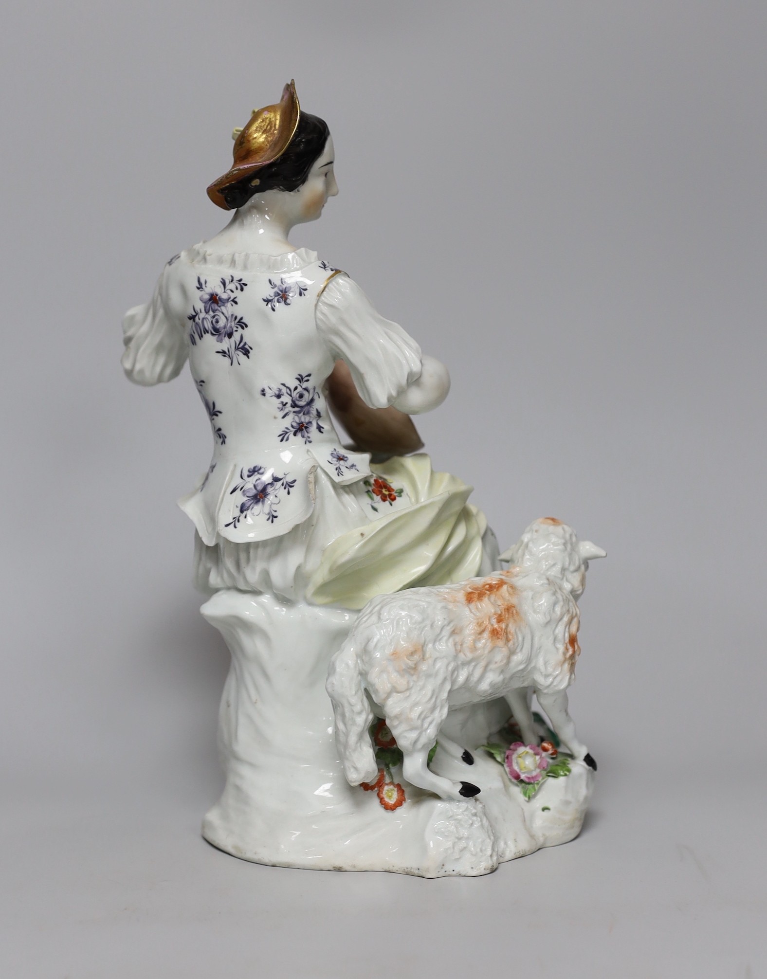 A large Derby figure of a shepherdess playing a lute, c.1760, 29cm